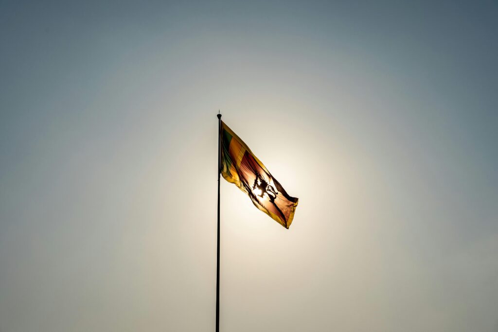 Celebrating Sri Lankan New Year: Traditions and Gift Etiquette 2 Sri Lankan Flag Silhouetted Against the Sun