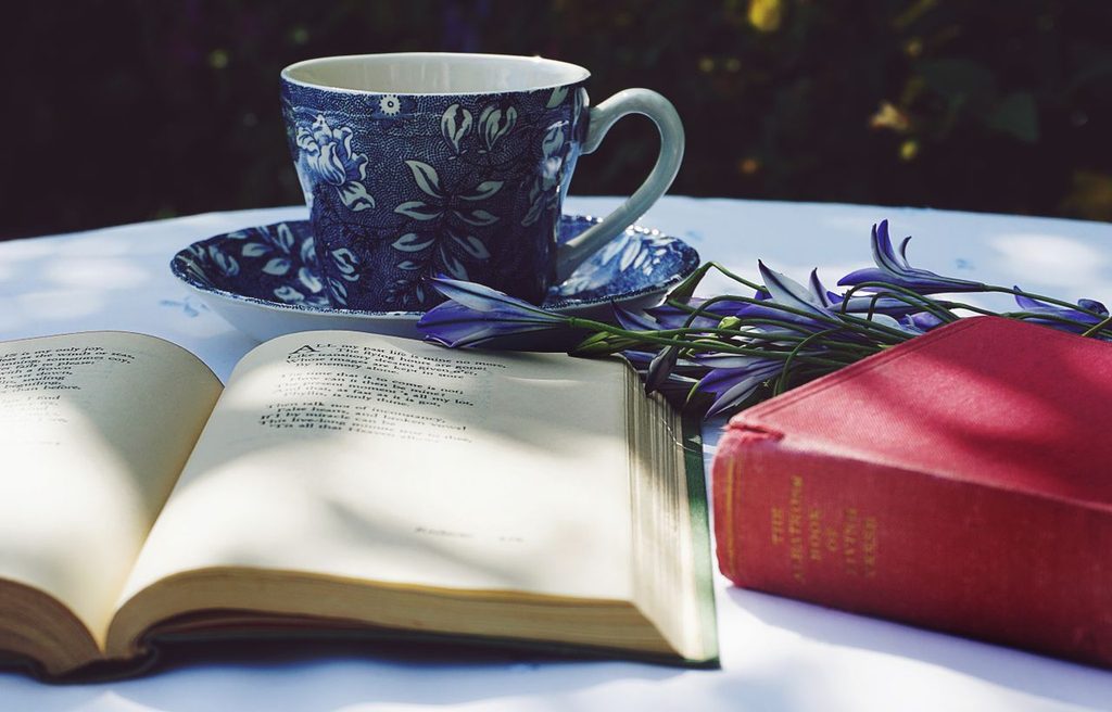 12 Thoughtful Nowruz Gift Ideas for Persian New Year 3 Spring flowers beside Persian poetry and tea cup